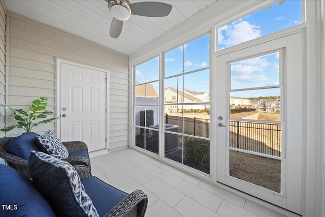 sunroom / solarium with ceiling fan