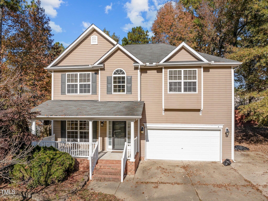 front facade with a porch and a garage