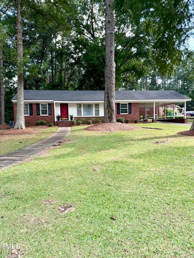 ranch-style home featuring a carport and a front lawn