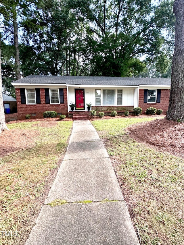 ranch-style home with a front yard