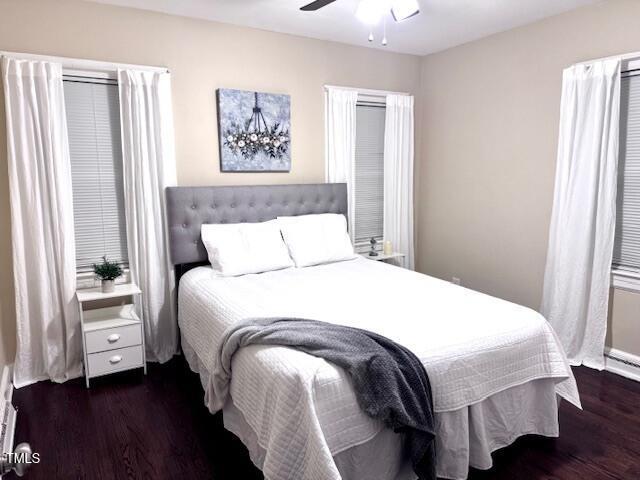 bedroom featuring dark wood-type flooring and ceiling fan