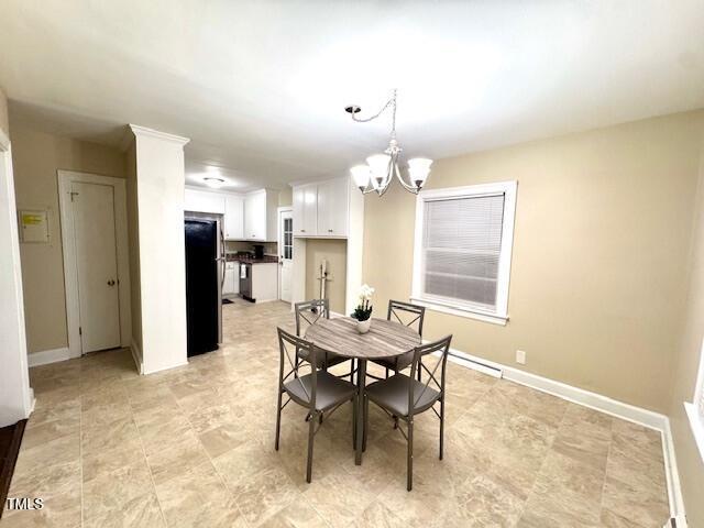 dining room featuring a notable chandelier