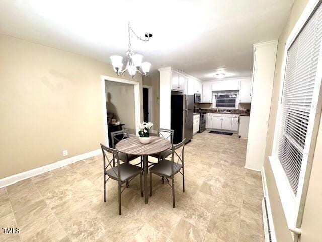 dining room with a notable chandelier