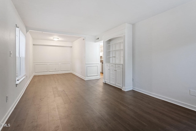 spare room featuring dark hardwood / wood-style flooring