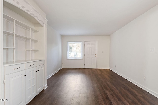 entrance foyer with dark hardwood / wood-style floors