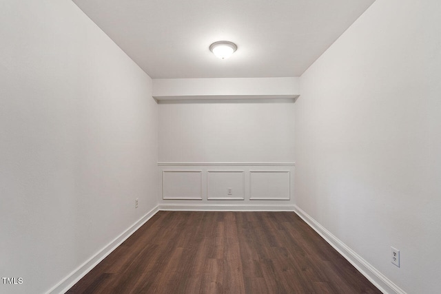 spare room with dark hardwood / wood-style floors