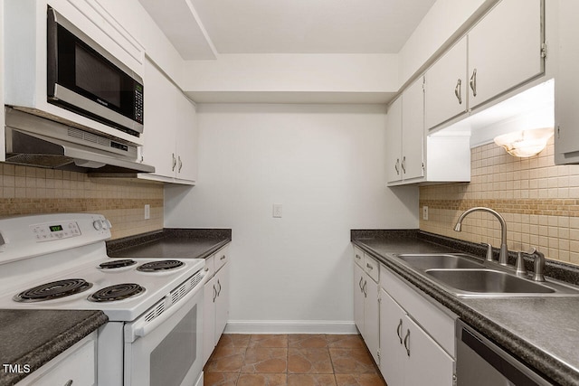 kitchen featuring tasteful backsplash, appliances with stainless steel finishes, sink, and white cabinets