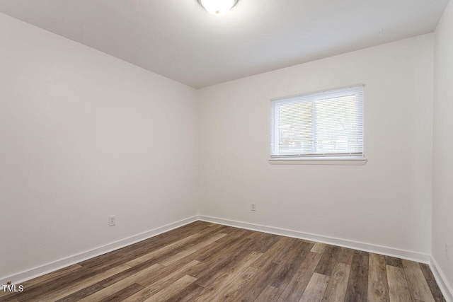 unfurnished room featuring hardwood / wood-style flooring