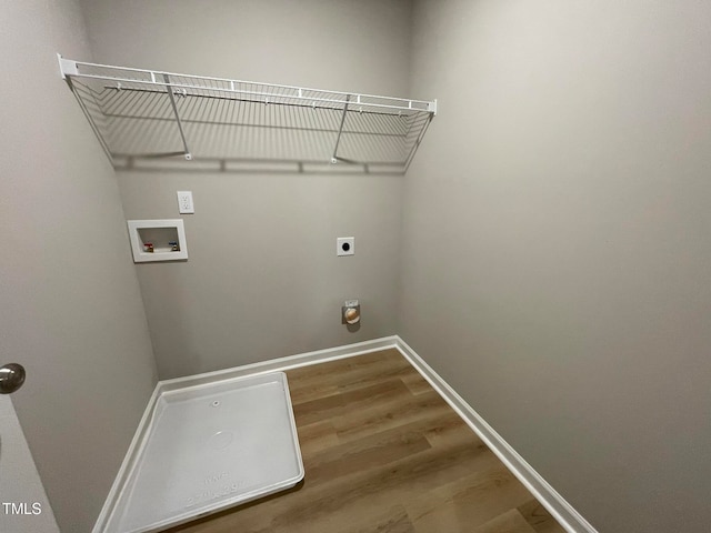 laundry area featuring hookup for a washing machine, electric dryer hookup, and wood-type flooring