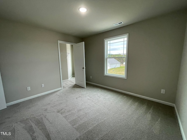 unfurnished bedroom featuring light colored carpet