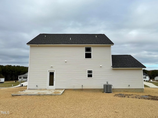 back of property featuring central air condition unit and a patio area