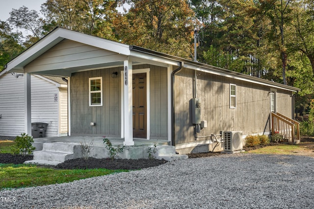 view of front facade featuring covered porch and ac unit