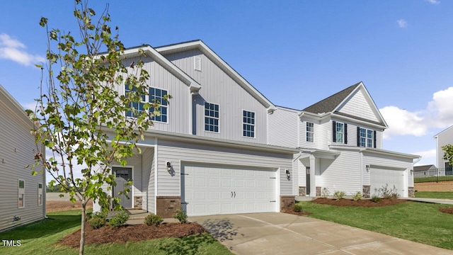 view of front of house featuring a front yard and a garage