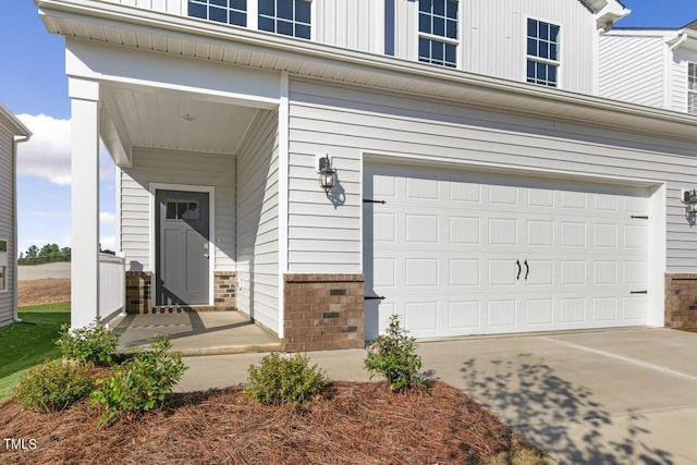 view of exterior entry featuring a garage