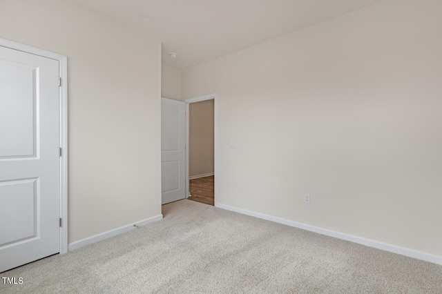 unfurnished bedroom featuring light colored carpet