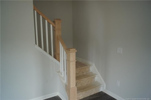 stairway with baseboards