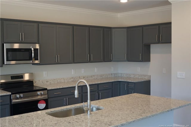 kitchen with stainless steel appliances, light stone countertops, ornamental molding, and a sink