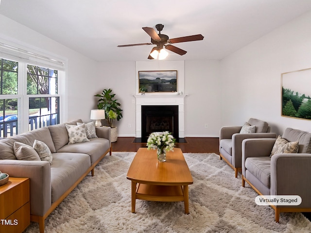 living room featuring hardwood / wood-style flooring and ceiling fan