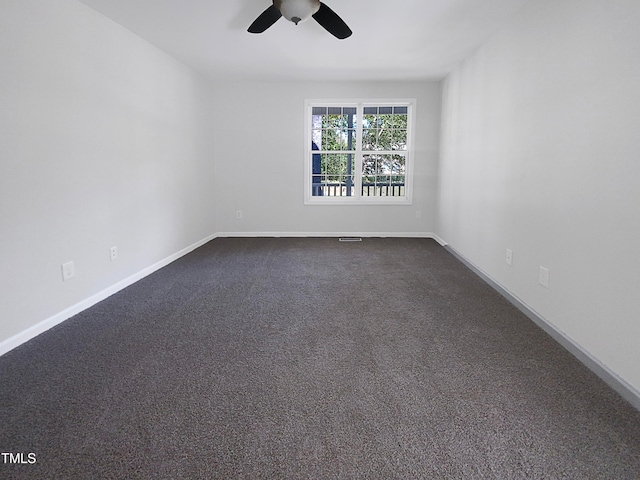 empty room featuring carpet and ceiling fan