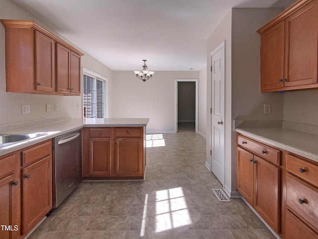 kitchen featuring stainless steel dishwasher, a chandelier, kitchen peninsula, and a healthy amount of sunlight