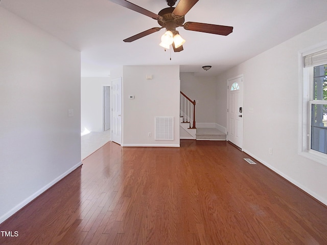 interior space featuring dark hardwood / wood-style floors and ceiling fan