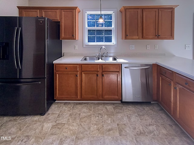 kitchen with dishwasher, sink, pendant lighting, and black fridge with ice dispenser