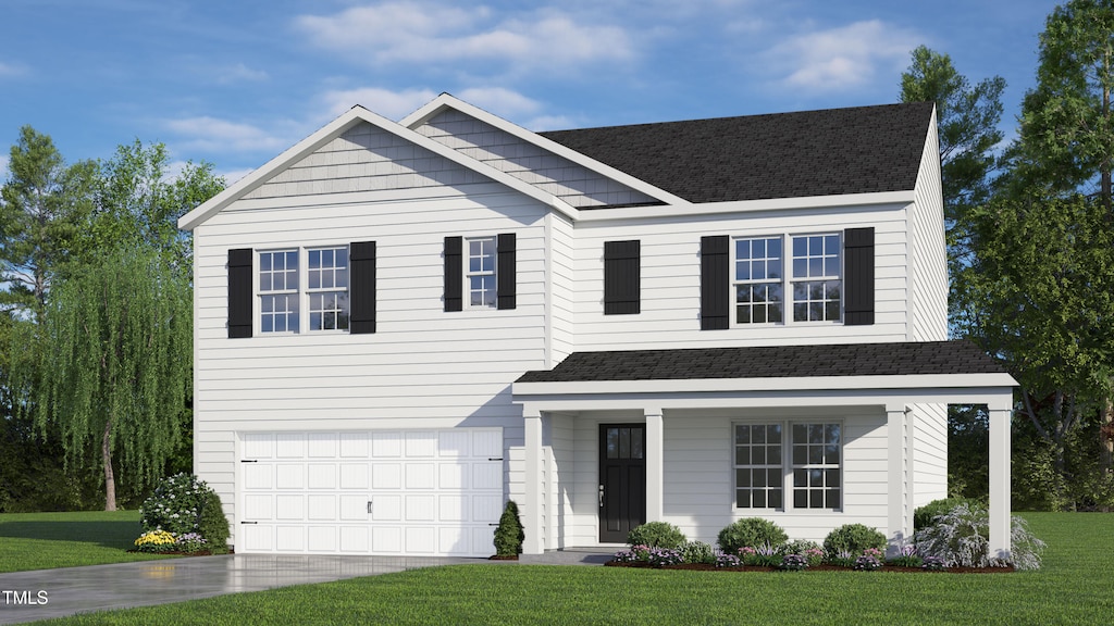 view of front of house featuring a front yard and a garage