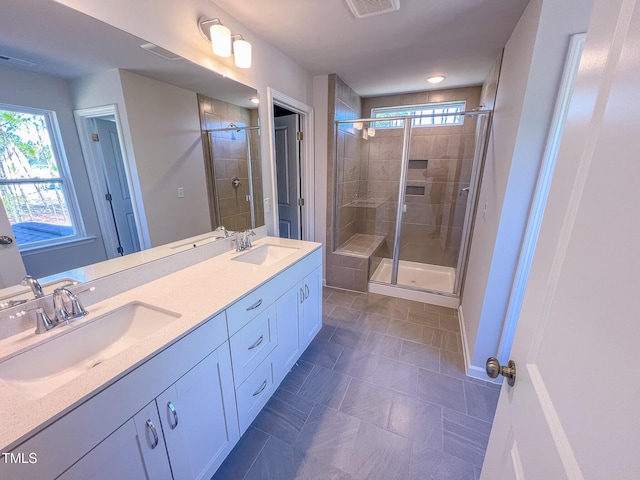 bathroom featuring vanity and an enclosed shower