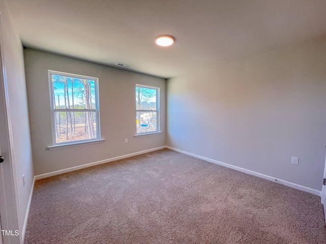 empty room featuring carpet flooring