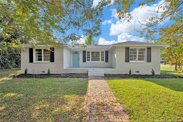 ranch-style house featuring a front lawn