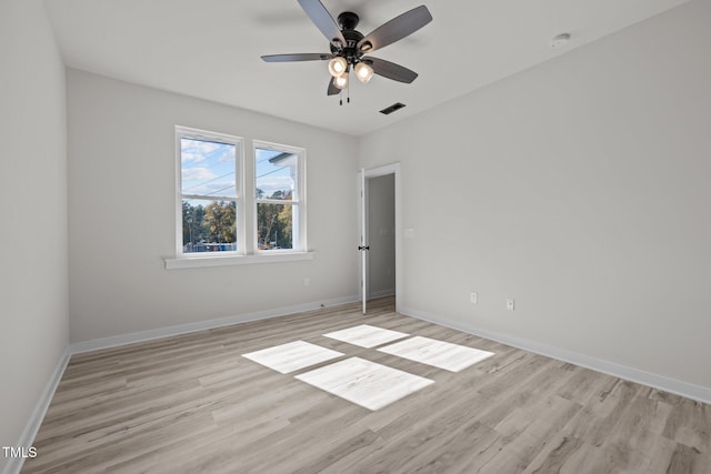 empty room with light hardwood / wood-style flooring and ceiling fan