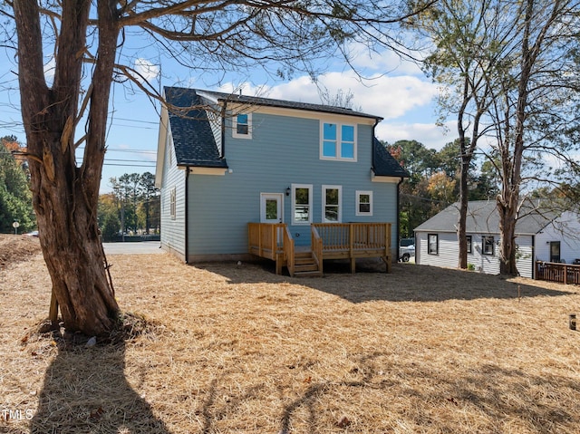 back of property featuring a wooden deck