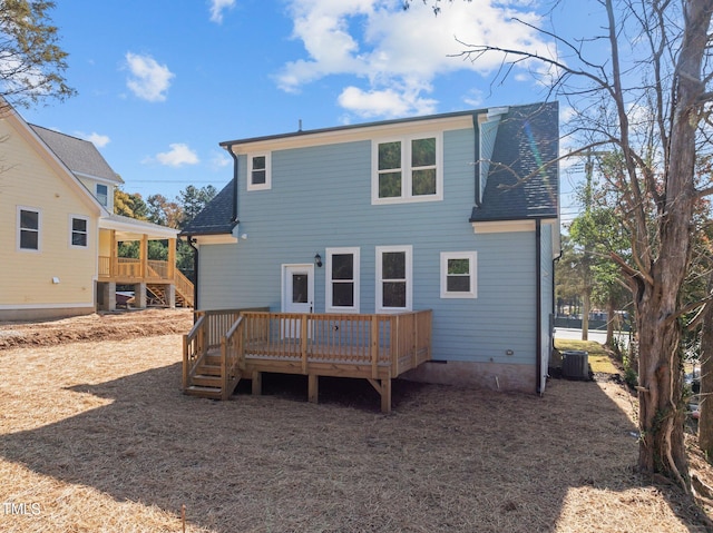 back of property with cooling unit and a deck