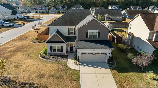 view of front facade featuring a front lawn and a garage