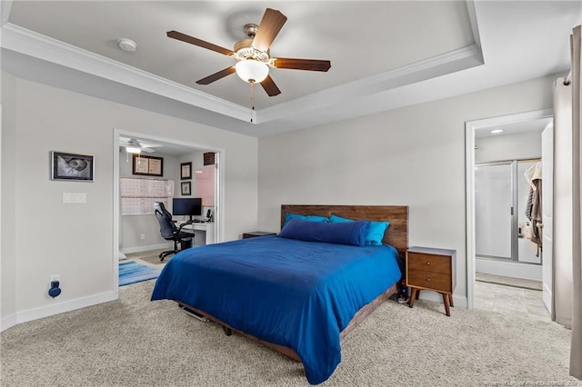 bedroom featuring ceiling fan, light carpet, a tray ceiling, and crown molding