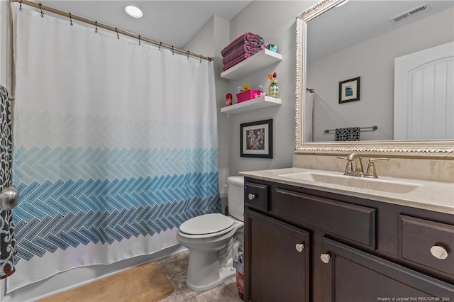 bathroom with vanity, toilet, and walk in shower