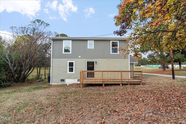 back of property with a wooden deck