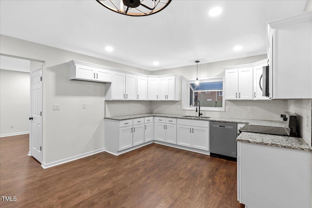 kitchen featuring dark hardwood / wood-style floors, stainless steel appliances, light stone countertops, pendant lighting, and white cabinets