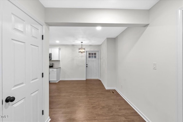 hallway featuring dark hardwood / wood-style floors