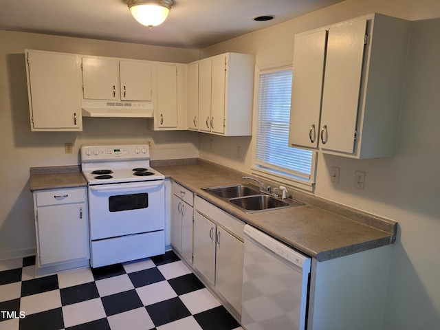 kitchen with white appliances, white cabinetry, and sink