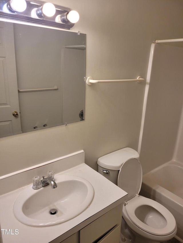 full bathroom with vanity, toilet, and shower / washtub combination