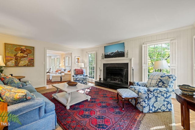 living room featuring crown molding and hardwood / wood-style flooring