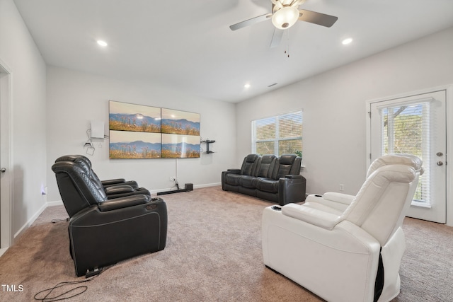 carpeted living room with plenty of natural light and ceiling fan