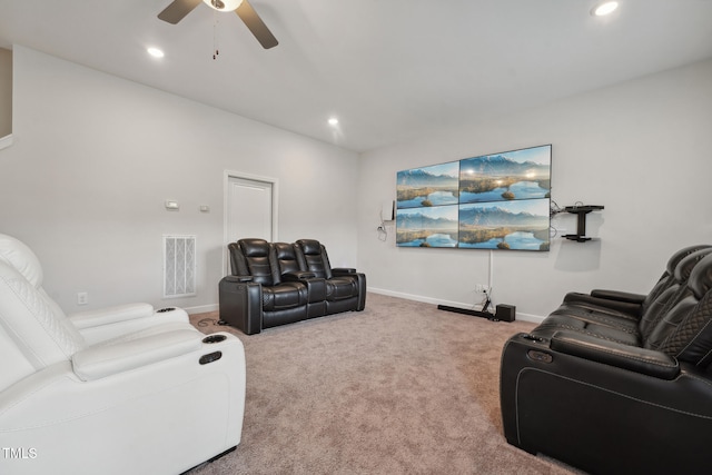 carpeted living room with ceiling fan