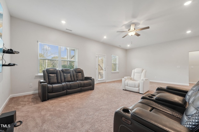 carpeted living room featuring ceiling fan