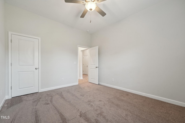 unfurnished bedroom featuring carpet flooring and ceiling fan