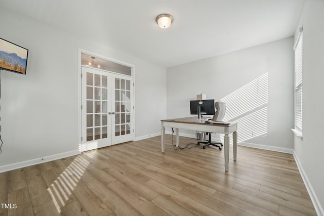 office featuring light hardwood / wood-style flooring and french doors