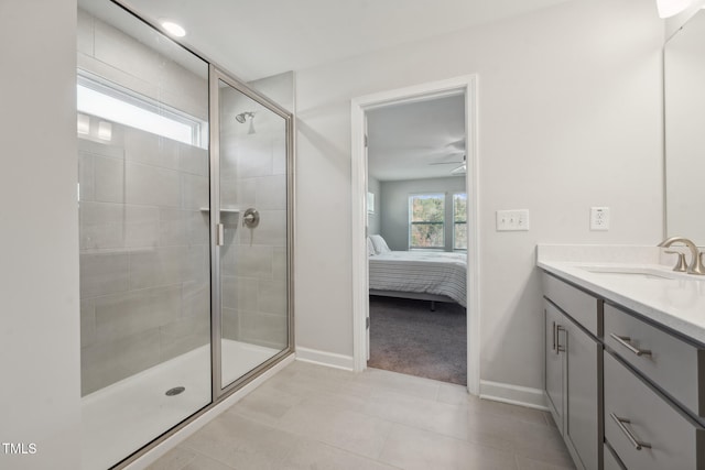 bathroom featuring vanity, walk in shower, ceiling fan, and tile patterned floors