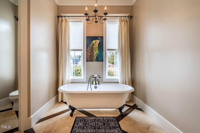 bathroom with a healthy amount of sunlight, a bathing tub, tile patterned flooring, and a notable chandelier