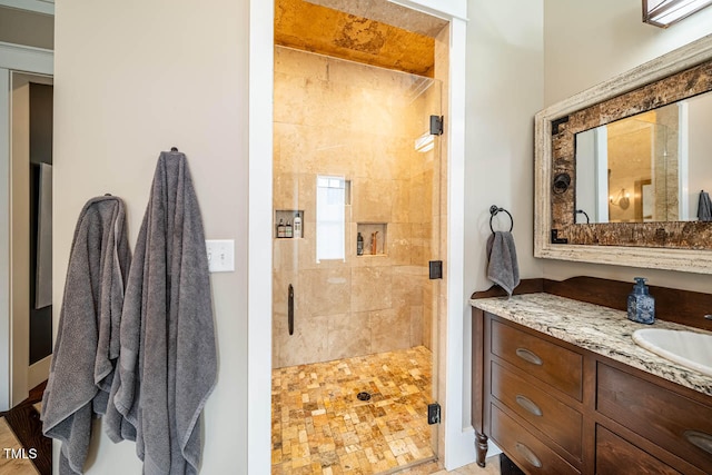 bathroom with vanity and an enclosed shower